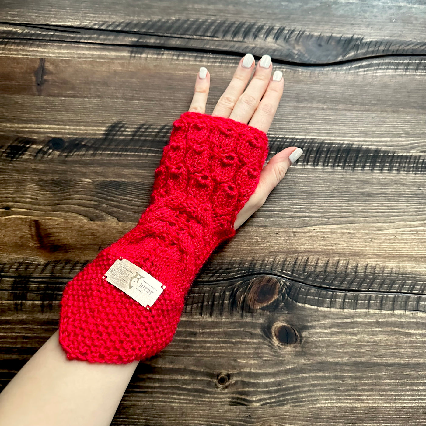 Handmade knitted yuletide red wrist warmers