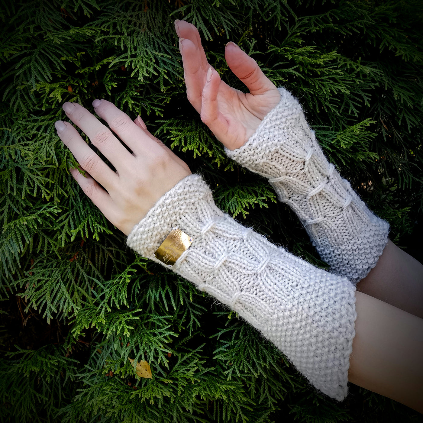 Handmade knitted sparkling white wrist warmers