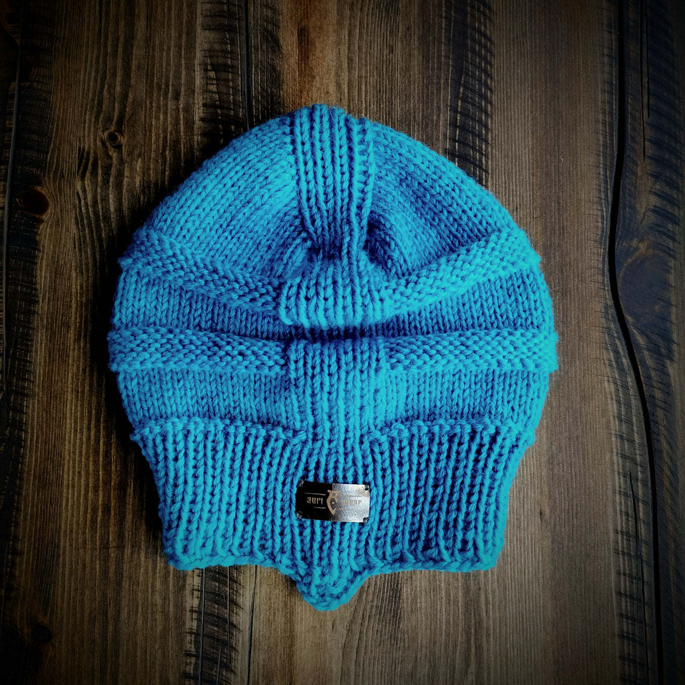 Handmade knitted azure blue beanie
